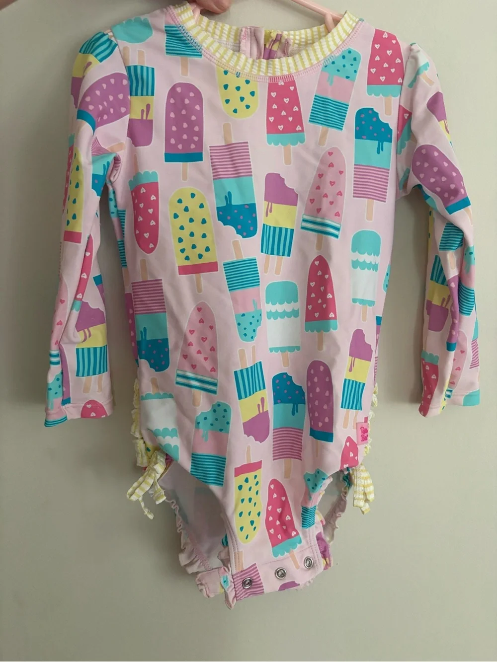 Ruffle Butts Pink Popsicle Print Long Sleeve Rashguard One-Piece